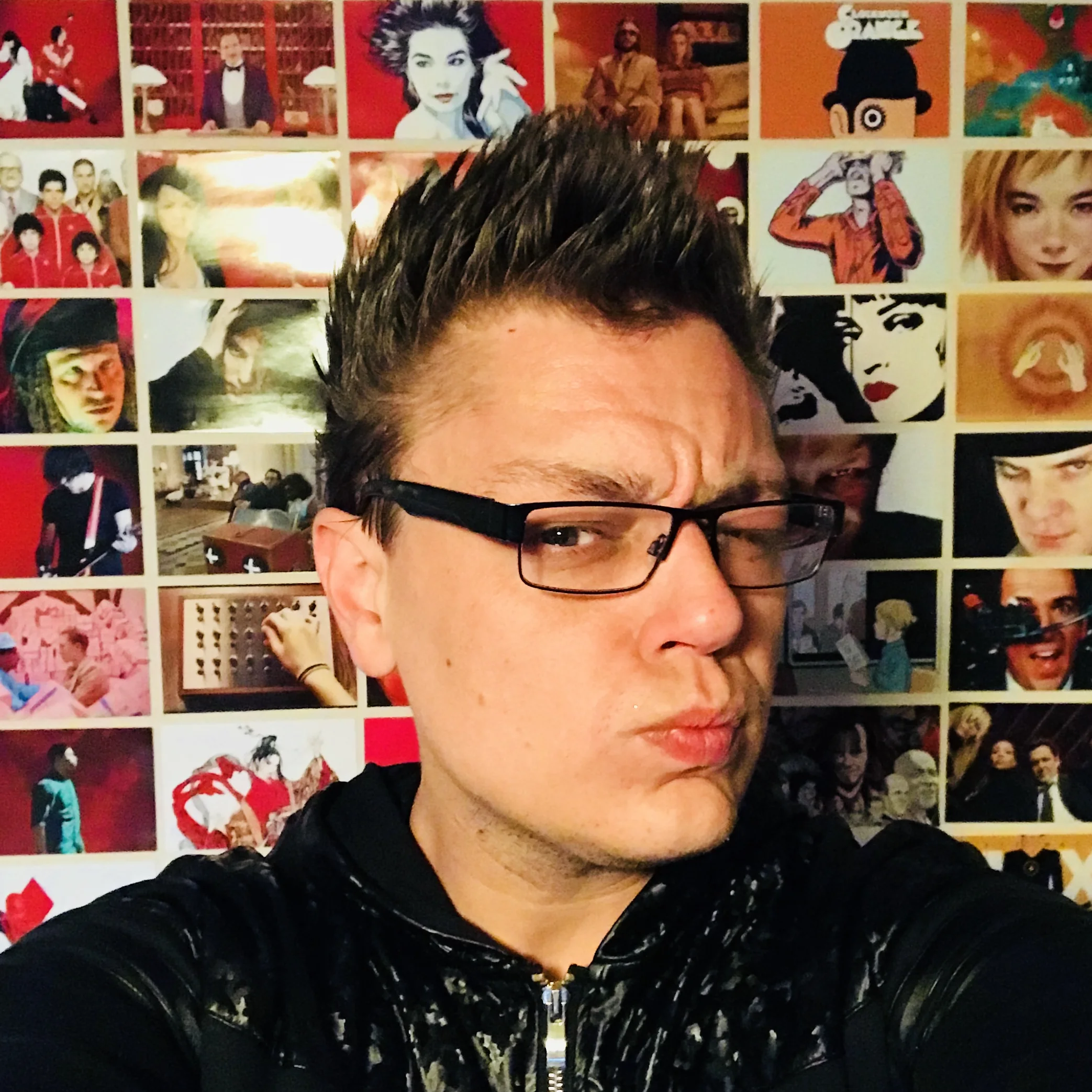 Quentin in front of a wall of visual references